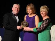 6 November 2010; Patrica Jackman, Waterford, is presented with her 2010 Camogie Soaring Star award by Cormac Farrell, Marketing Director, O'Neills, and President of the Camogie Association Joan O' Flynn at the 2010 Camogie All-Stars in association with O’Neills. Citywest Hotel, Saggart, Co. Dublin. Picture credit: Stephen McCarthy / SPORTSFILE