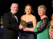 6 November 2010; Áine Lyng, Waterford, is presented with her 2010 Camogie Soaring Star award by Cormac Farrell, Marketing Director, O'Neills, and President of the Camogie Association Joan O' Flynn at the 2010 Camogie All-Stars in association with O’Neills. Citywest Hotel, Saggart, Co. Dublin. Picture credit: Stephen McCarthy / SPORTSFILE