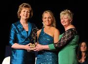 6 November 2010; Katrina Parrock, Wexford, is presented with her 2010 Camogie All-Star award by President Mary McAleese and President of the Camogie Association Joan O' Flynn at the 2010 Camogie All-Stars in association with O’Neills. Citywest Hotel, Saggart, Co. Dublin. Picture credit: Stephen McCarthy / SPORTSFILE