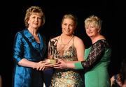 6 November 2010; Ursula Jacob, Wexford, is presented with her 2010 Camogie All-Star award by  President Mary McAleese and President of the Camogie Association Joan O' Flynn at the 2010 Camogie All-Stars in association with O’Neills. Citywest Hotel, Saggart, Co. Dublin. Picture credit: Stephen McCarthy / SPORTSFILE