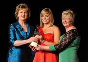 6 November 2010; Anna Geary, Cork, is presented with her 2010 Camogie All-Star award by President Mary McAleese and President of the Camogie Association Joan O' Flynn at the 2010 Camogie All-Stars in association with O’Neills. Citywest Hotel, Saggart, Co. Dublin. Picture credit: Stephen McCarthy / SPORTSFILE