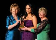 6 November 2010; Mary Leacy, Wexford, is presented with her 2010 Camogie All-Star award by President Mary McAleese and President of the Camogie Association Joan O' Flynn at the 2010 Camogie All-Stars in association with O’Neills. Citywest Hotel, Saggart, Co. Dublin. Picture credit: Stephen McCarthy / SPORTSFILE