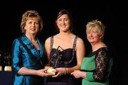 6 November 2010; Catherine O' Loughlin, Wexford, is presented with her 2010 Camogie All-Star award by President Mary McAleese and President of the Camogie Association Joan O' Flynn at the 2010 Camogie All-Stars in association with O’Neills. Citywest Hotel, Saggart, Co. Dublin. Picture credit: Stephen McCarthy / SPORTSFILE