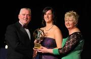 6 November 2010; Elaine Dermody, Offaly, is presented with her 2010 Camogie Intermediate Soaring Star award by Cormac Farrell, Marketing Director, O'Neills and President of the Camogie Association Joan O' Flynn at the 2010 Camogie All-Stars in association with O’Neills. Citywest Hotel, Saggart, Co. Dublin. Picture credit: Stephen McCarthy / SPORTSFILE