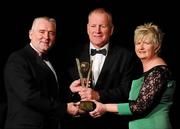 6 November 2010; Joachim Kelly, Offaly, is presented with his 2010 Camogie Manager of the Year award by President of the Camogie Association Joan O' Flynn, and Cormac Farrell, Marketing Director, O'Neills, left, at the 2010 Camogie All-Stars in association with O’Neills. Citywest Hotel, Saggart, Co. Dublin. Picture credit: Stephen McCarthy / SPORTSFILE