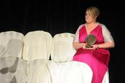 6 November 2010; Caroline Connaughton, Roscommon, watches the ceremony with her 2010 Camogie Soaring Star award, at the 2010 Camogie All-Stars in association with O’Neills. Citywest Hotel, Saggart, Co. Dublin. Picture credit: Stephen McCarthy / SPORTSFILE
