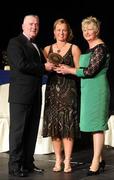 6 November 2010; Kerrie O'Neill, Antrim, is presented with her 2010 Camogie Soaring Star award by Cormac Farrell, Marketing Director, O'Neills, and President of the Camogie Association Joan O' Flynn at the 2010 Camogie All-Stars in association with O’Neills. Citywest Hotel, Saggart, Co. Dublin. Picture credit: Stephen McCarthy / SPORTSFILE