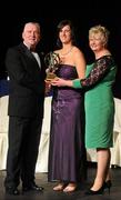 6 November 2010; Elaine Dermody, Offaly, is presented with her 2010 Camogie Intermediate Soaring Star award by Cormac Farrell, Marketing Director, O'Neills and President of the Camogie Association Joan O' Flynn at the 2010 Camogie All-Stars in association with O’Neills. Citywest Hotel, Saggart, Co. Dublin. Picture credit: Stephen McCarthy / SPORTSFILE