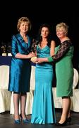 6 November 2010; Claire O'Connor, Wexford, is presented with her 2010 Camogie All-Star award by President Mary McAleese and President of the Camogie Association Joan O' Flynn at the 2010 Camogie All-Stars in association with O’Neills. Citywest Hotel, Saggart, Co. Dublin. Picture credit: Stephen McCarthy / SPORTSFILE