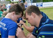 17 August 2016; Leinster Rugby's Rhys Ruddock with Vincent Barrett, aged 8, from Bray, at the Bank of Ireland Leinster Rugby Camp at Blackrock College RFC, Stradbrook Road, Blackrock, Co Dublin. Photo by Piaras Ó Mídheach/Sportsfile