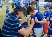 17 August 2016; Leinster Rugby's Jordi Murphy with Vincent Barrett, aged 8, from Bray, at the Bank of Ireland Leinster Rugby Camp at Blackrock College RFC, Stradbrook Road, Blackrock, Co Dublin. Photo by Piaras Ó Mídheach/Sportsfile