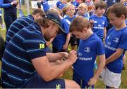 17 August 2016; Leinster Rugby's Jordi Murphy signs an autograph for Ciarán Halfpenny, aged 6, at the Bank of Ireland Leinster Rugby Camp at Blackrock College RFC, Stradbrook Road, Blackrock, Co Dublin. Photo by Piaras Ó Mídheach/Sportsfile