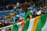 18 August 2016; Team Ireland silver medallist in rowing Gary O'Donovan affixes a tri-colour ahead of the Men's 400m hurdles final in the Olympic Stadium, Maracanã, during the 2016 Rio Summer Olympic Games in Rio de Janeiro, Brazil. Photo by Brendan Moran/Sportsfile