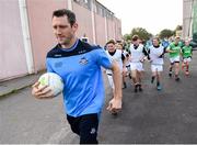 18 August 2016; Dublin senior footballer Denis Bastick jogs out with U14s from Fingal Ravens GAA Club for a training session organised by Aer Lingus - Official Airline to Dublin GAA. Fingal Ravens GAA Club were given the opportunity to train with their heroes after being selected as the winner of an Aer Lingus staff competition where employees had the chance to nominate their local GAA club. St. David’s CBS, Artane, Dublin. Photo by Cody Glenn/Sportsfile