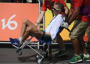 19 August 2016; Jared Tallent of Australia is carried from the course on a wheelchair after winning a silver medal in the Men's 50km Walk Final during the 2016 Rio Summer Olympic Games in Rio de Janeiro, Brazil. Photo by Brendan Moran/Sportsfile