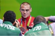 20 August 2016; Vladimir Nikitin of Russia poses for photographers after being presented with his Bantamweight bronze medal at the Riocentro Pavillion 6 Arena during the 2016 Rio Summer Olympic Games in Rio de Janeiro, Brazil. Photo by Stephen McCarthy/Sportsfile