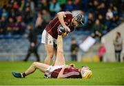 20 August 2016; Darragh O'Donoghue helps his Galway team-mate Conor Jennings with cramp during extra-time in the Bord Gáis Energy GAA Hurling U21 Championship Semi-Final game between Dublin v Galway at Semple Stadium in Thurles, Co Tipperary. Photo by Piaras Ó Mídheach/Sportsfile