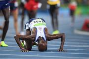 20 August 2016; Mo Farah of Great Britain kisses the ground after winning the Men's 5000m final in the Olympic Stadium during the 2016 Rio Summer Olympic Games in Rio de Janeiro, Brazil. Photo by Ramsey Cardy/Sportsfile