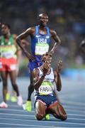 20 August 2016; Mo Farah of Great Britain sinks to his knees after winning the Men's 5000m final in the Olympic Stadium during the 2016 Rio Summer Olympic Games in Rio de Janeiro, Brazil. Photo by Ramsey Cardy/Sportsfile