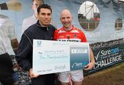 13 November 2010; GAA All Stars Sean Og O hAilpin and Alan Brogan were in parnell Park, Dublin, today as the five finalists of the SureMen challenge go head to head to win €10,000 for their club. The winning football and winning hurling team took €10,000 home to invest in the club. Pictured is Sean Og O hAilpin presenting the cheque for the winner of the Hurling Challenge to Vincent Hurley from Courcey Rovers, Cork. For more visit www.suremen.ie. SureMen Challenge Final, Parnell Park, Dublin. Photo by Sportsfile