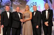 13 November 2010; Brid Stack, Cork, is presented with her All Star award by Pat Quill, President, Cumann Peil Gael na mBan, in the company of, from left, Pol O Gallchoir, Ceannsai, TG4, Uachtarán CLG Criostóir Ó Cuana, and Tony Towell, Managing Director, O'Neill's, at the O'Neills TG4 Ladies Football All-Star Awards 2010, Citywest Hotel, Saggart, Co. Dublin. Picture credit: Brendan Moran / SPORTSFILE