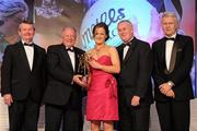 13 November 2010; Gemma Begley, Tyrone, is presented with her All Star award by Pat Quill, President, Cumann Peil Gael na mBan, in the company of, from left, Pol O Gallchoir, Ceannsai, TG4, Uachtarán CLG Criostóir Ó Cuana, and Tony Towell, Managing Director, O'Neill's, at the O'Neills TG4 Ladies Football All-Star Awards 2010, Citywest Hotel, Saggart, Co. Dublin. Picture credit: Brendan Moran / SPORTSFILE