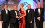 13 November 2010; Yvonne McMonagle, Donegal, is presented with her All Star award by Pat Quill, President, Cumann Peil Gael na mBan, in the company of, from left, Pol O Gallchoir, Ceannsai, TG4, Uachtarán CLG Criostóir Ó Cuana, and Tony Towell, Managing Director, O'Neill's, at the O'Neills TG4 Ladies Football All-Star Awards 2010, Citywest Hotel, Saggart, Co. Dublin. Picture credit: Brendan Moran / SPORTSFILE