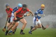 14 November 2010; Garrett Sinnott, Oulart-the-Ballagh, with support from Rory Jacob, in action against Brian Connaughton, left, and Conor Jordan, Raharney. AIB GAA Hurling Leinster Club Senior Championship Semi-Final, Raharney v Oulart-the-Ballagh, Cusack Park, Mullingar. Picture credit: Barry Cregg / SPORTSFILE