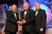 13 November 2010; Johnny Hayes, Clare, is presented with the Hall of Fame Award by Pat Quill, left, President, Cumann Peil Gael na mBan, and Uachtarán CLG Criostóir Ó Cuana, at the O'Neills TG4 Ladies Football All-Star Awards 2010, Citywest Hotel, Saggart, Co. Dublin. Picture credit: Brendan Moran / SPORTSFILE