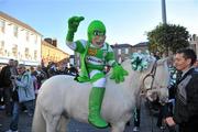 14 November 2010; Shamrock Rovers mascot Hooperman gets a lift on Prince the horse before walking a traditional route from Ringsend to Lansdowne Road before the start of the game. FAI Ford Cup Final, Shamrock Rovers v Sligo Rovers, Aviva Stadium, Lansdowne Road, Dublin. Picture credit: David Maher / SPORTSFILE