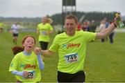 21 August 2016; Jockey Johnny Murtagh and his daughter Grace during The Jog For Jockeys in aid of Irish Injured Jockeys. Over 400 runners took part in the annual Jog For Jockeys 5km and 10km charity runs in aid of Irish Injured Jockeys at the Curragh Racecourse in Kildare today. Photo by Piaras Ó Mídheach/Sportsfile