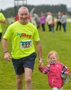21 August 2016; Retired Jockey David Casey with his daughter Clodagh during The Jog For Jockeys in aid of Irish Injured Jockeys. Over 400 runners took part in the annual Jog For Jockeys 5km and 10km charity runs in aid of Irish Injured Jockeys at the Curragh Racecourse in Kildare today. Photo by Piaras Ó Mídheach/Sportsfile