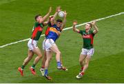 21 August 2016; Michael Quinlivan of Tipperary in action against Mayo's, from left, Barry Moran, Lee Keegan and Colm Boyle during the GAA Football All-Ireland Senior Championship Semi-Final game between Mayo and Tipperary at Croke Park in Dublin. Photo by Piaras Ó Mídheach/Sportsfile