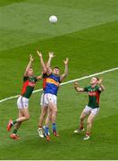 21 August 2016; Michael Quinlivan of Tipperary in action against Mayo's, from left, Barry Moran, Lee Keegan and Colm Boyle during the GAA Football All-Ireland Senior Championship Semi-Final game between Mayo and Tipperary at Croke Park in Dublin. Photo by Piaras Ó Mídheach/Sportsfile