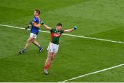 21 August 2016; Conor O'Shea of Mayo celebrates scoring his side's second goal as Bill Maher of Tipperary looks on during the GAA Football All-Ireland Senior Championship Semi-Final game between Mayo and Tipperary at Croke Park in Dublin. Photo by Piaras Ó Mídheach/Sportsfile