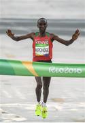 21 August 2016; Eliud Kipchoge of Kenya crosses the line to win the Men's Marathon at Sambódromo, Maracanã, during the 2016 Rio Summer Olympic Games in Rio de Janeiro, Brazil. Photo by Brendan Moran/Sportsfile