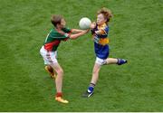 21 August 2016; Blaine Lynch, St Patrick's PS, Castlederg, Tyrone, representing Tipperary, in action against Mark McDermott, Crubany NS, Cavan, representing Mayo, during the INTO Cumann na mBunscol GAA Respect Exhibition Go Games during the GAA Football All-Ireland Senior Championship Semi-Final game between Mayo and Tipperary at Croke Park in Dublin. Photo by Piaras Ó Mídheach/Sportsfile