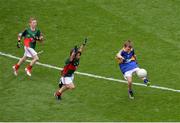 21 August 2016; John Ryan, Scoil Eóin Bosco, Navan Road, Dublin, representing Tipperary, in action against Donal McSorley, Lacken NS, Ballinagh, Cavan, representing Mayo, and Jamie Kennedy, St John's NS, Temple Street, Sligo, representing Mayo, left, during the INTO Cumann na mBunscol GAA Respect Exhibition Go Games during the GAA Football All-Ireland Senior Championship Semi-Final game between Mayo and Tipperary at Croke Park in Dublin. Photo by Piaras Ó Mídheach/Sportsfile