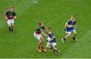 21 August 2016; Conlan O'Kane, St Brigids, Knockloughrim, Derry, representing Tipperary, in action against Mark McDermott, Crubany NS, Cavan, representing Mayo, during the INTO Cumann na mBunscol GAA Respect Exhibition Go Games during the GAA Football All-Ireland Senior Championship Semi-Final game between Mayo and Tipperary at Croke Park in Dublin. Photo by Piaras Ó Mídheach/Sportsfile