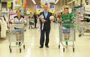 16 November 2010; The captains of the six competing clubs in this year’s Tesco All-Ireland Club Championship finals gathered in Naas in Tesco’s largest store in the country ahead of the finals. Pictured are Junior players Emma Nugent, left, St. Enda's, Co. Tyrone, and Ciara Kilroy, Caltra Cuans', Co. Galway, with John Prendergast, Head of Trade Planning and Local Marketing, Tesco Ireland. Tesco All-Ireland Ladies Football Club Championship Finals Captains Day, Tesco, Monread Road, Naas, Co. Kildare. Photo by Sportsfile