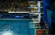 15 August 2016; (EDITOR'S NOTE; A variable planed lens was used in the creation of this image) Yuan Cao of China  competes in the preliminary round of the Men's 3m springboard in the Maria Lenk Aquatics Centre, Barra da Tijuca, during the 2016 Rio Summer Olympic Games in Rio de Janeiro, Brazil. Photo by Brendan Moran/Sportsfile