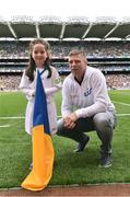 21 August 2016; eir Flagbearer Maria Hayes, age 7, from Co. Tipperary, with eir GAA ambassador Tomás Ó Sé at the All-Ireland Senior Championship Semi-Final game between Mayo and Tipperary at Croke Park in Dublin. Photo by David Maher/Sportsfile