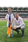 21 August 2016; eir Flagbearer Darragh Kennedy, age 9, from Thurles, Co. Tipperary, with eir GAA ambassador Tomás Ó Sé at the All-Ireland Senior Championship Semi-Final game between Mayo and Tipperary at Croke Park in Dublin. Photo by David Maher/Sportsfile