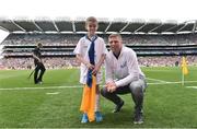 21 August 2016; eir Flagbearer Darragh Kennedy, age 8, from Thurles, Co. Tipperary, with eir GAA ambassador Tomás Ó Sé at the All-Ireland Senior Championship Semi-Final game between Mayo and Tipperary at Croke Park in Dublin. Photo by David Maher/Sportsfile
