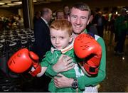 24 August 2016; Boxer Paddy Barnes with Joel Thomas, age 5, from Baldoyle, Co Dublin, at Dublin Airport as Team Ireland arrive home from the Games of the XXXI Olympiad at Dublin Airport in Dublin. Photo by Seb Daly/Sportsfile