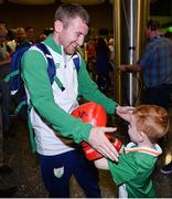 24 August 2016; Boxer Paddy Barnes is greeted by Joel Thomas, age 5, from Baldoyle, Co Dublin, at Dublin Airport as Team Ireland arrive home from the Games of the XXXI Olympiad at Dublin Airport in Dublin. Photo by Seb Daly/Sportsfile
