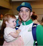 24 August 2016; Boxer Michael Conlan with his daughter Luisne, age 18 months, at Dublin Airport as Team Ireland arrive home from the Games of the XXXI Olympiad at Dublin Airport in Dublin. Photo by Seb Daly/Sportsfile