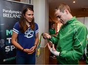 25 August 2016; Pictured at the Official Farewell event for members of the Irish Paralympic Team is 2016 Olympic Games silver medallist Annalise Murphy, right, with footballer Ryan Nolan, at the Clayton Hotel in Dublin Airport, Dublin. Photo by Seb Daly/Sportsfile