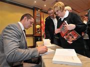 17 November 2010; Alan Quinlan signs a book for Ann Simpson, from Shannon, Co. Clare, at the launch of Red Blooded – The Alan Quinlan Autobiography, Castletroy Park Hotel, Limerick. Picture credit: Diarmuid Greene / SPORTSFILE