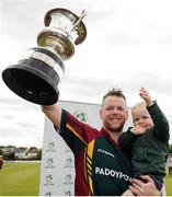 27 August 2016; Merrion CC captain Dom Joyce lifts the cup with son Alexander, age 19 months, following his team's victory during the Irish Cricket Senior Cup Final against Waringstown CC at Castle Avenue in Clontarf, Co. Dublin. Photo by Seb Daly/Sportsfile